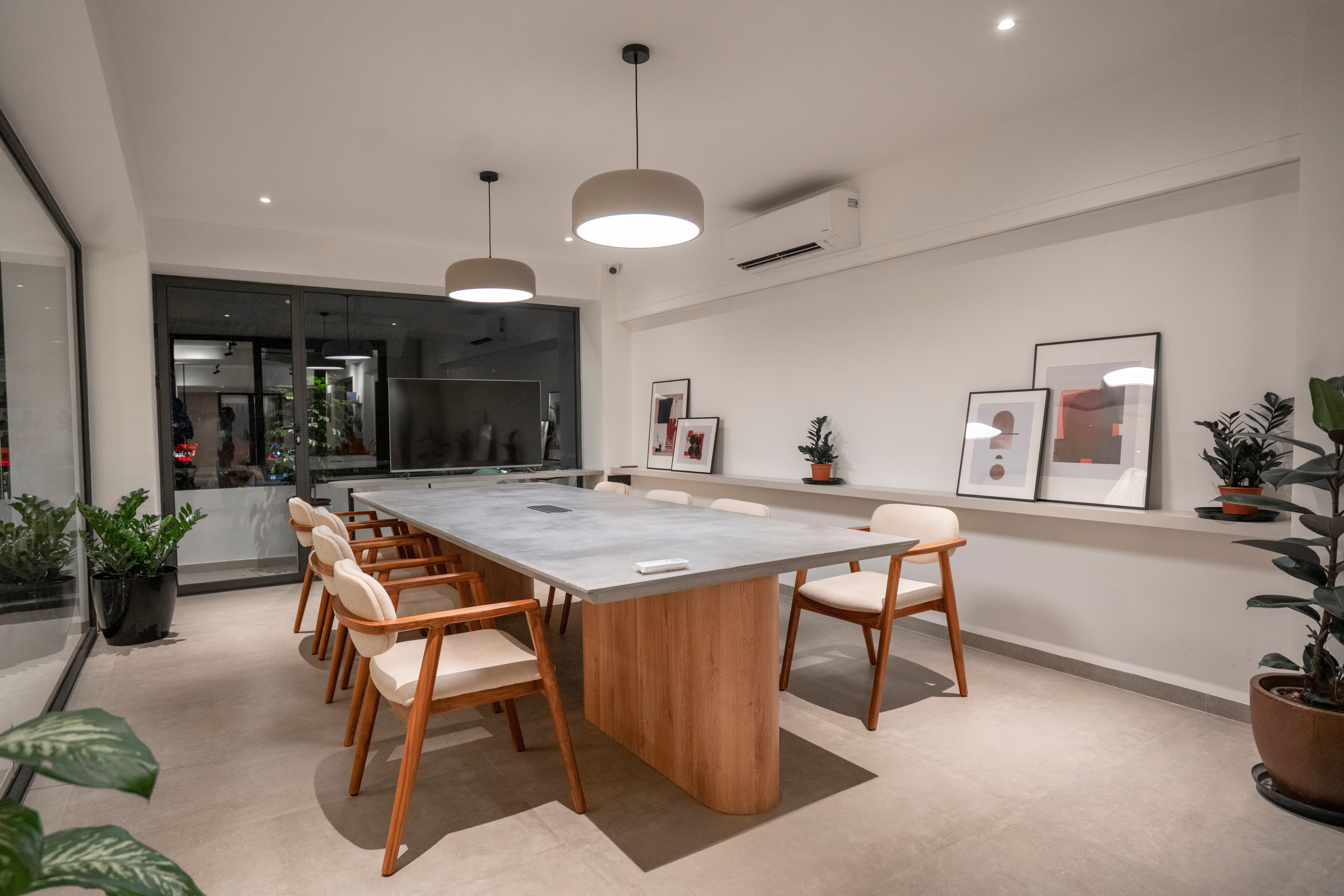 Paper and Pie conference room with concrete table and modern chairs